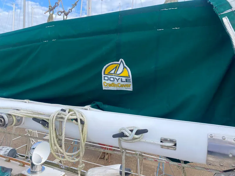 Slide: The Image of Green sail cover on 1983 Shannon 38 boat with Doyle logo. - 16