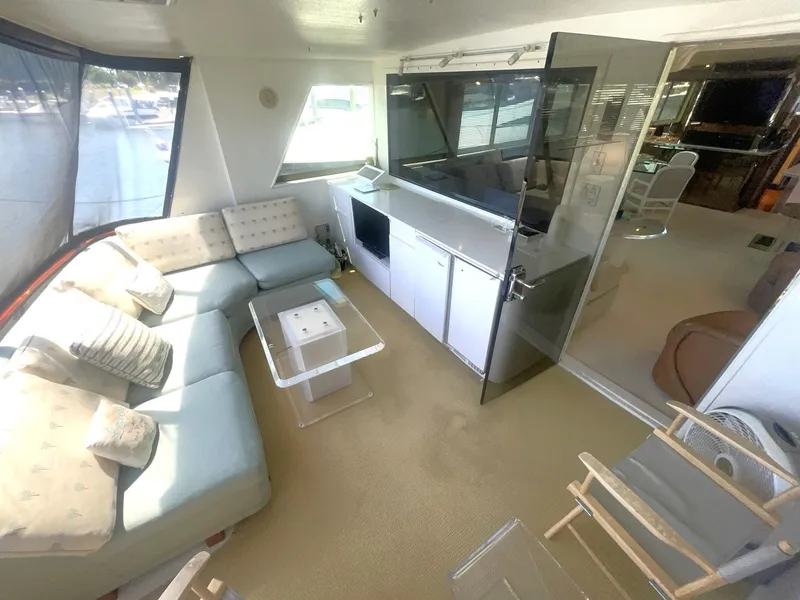 Slide: The Image of CLIMATE CONTROLLED AFT DECK LOOKING TO PORT W/WETBAR & ENTERTAINMENT - 20