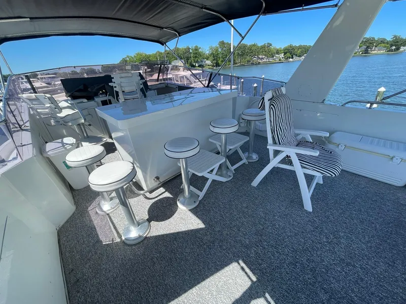 Slide: The Image of BRIDGE LOOKING FORWARD TO HELM & WETBAR W/BAR STOOLS - 65