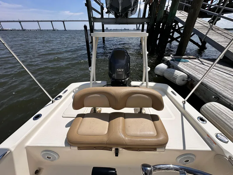 Slide: The Image of 2020 Scout 177 Sport boat with Yamaha 90 engine, docked by a wooden pier. - 10