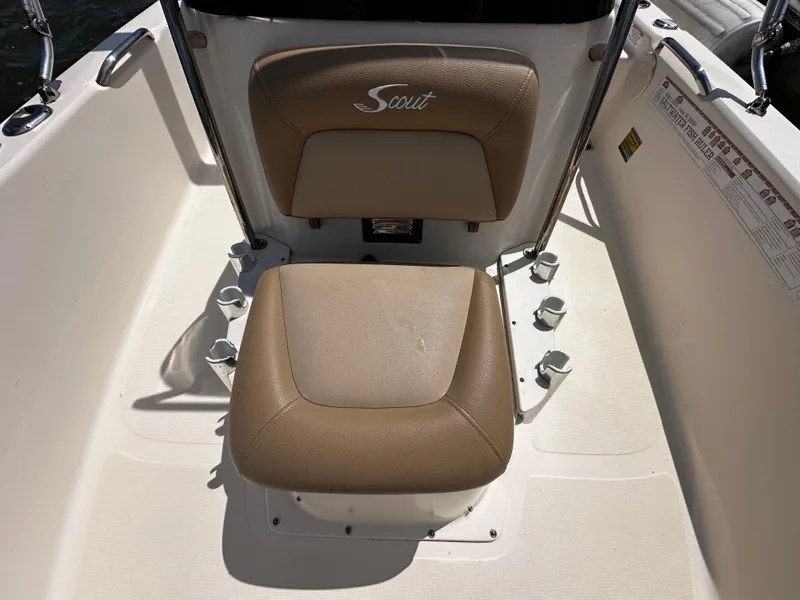 Slide: The Image of 2020 Scout 177 Sport boat seat with beige upholstery and Scout logo. - 13