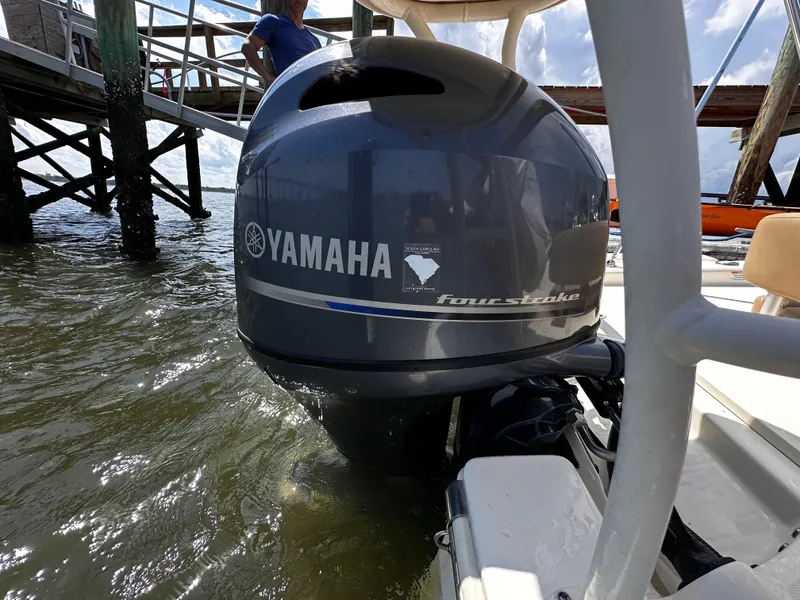 Slide: The Image of 2020 Scout 177 Sport boat with Yamaha outboard motor near a dock. - 16