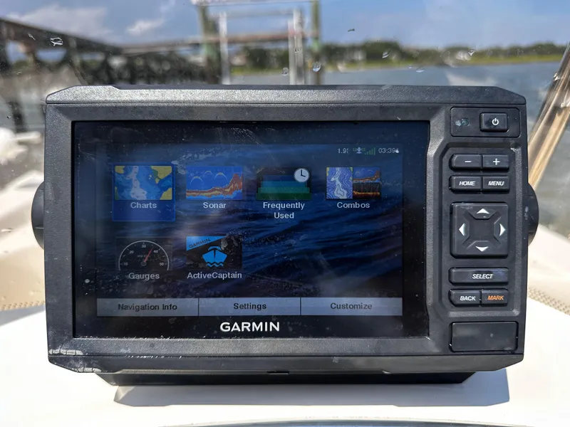 Slide: The Image of Garmin navigation system on 2020 Scout 177 Sport boat, displaying charts and sonar options. - 18