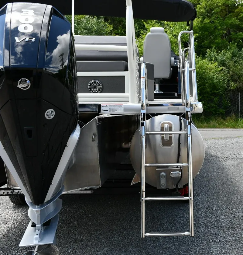 Slide: The Image of 2024 Premier 250 Solaris pontoon boat with powerful outboard motor and sleek design. - 10