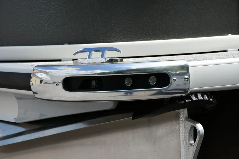Slide: The Image of 2024 Premier 250 Solaris boat detail with chrome hardware and sleek design. - 11