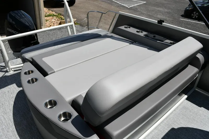 Slide: The Image of 2024 Premier 250 Solaris boat with cushioned seating and cup holders. - 13