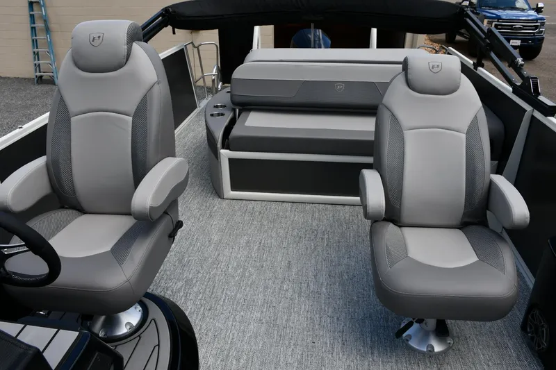 Slide: The Image of 2024 Premier 250 Solaris boat interior with plush gray seating and modern design. - 6