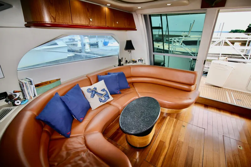 Slide: The Image of Luxurious interior of 2001 Maxum 4600 SCB yacht with leather seating and nautical decor. - 16