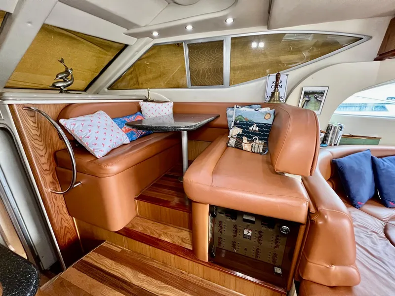 Slide: The Image of Luxurious interior of 2001 Maxum 4600 SCB yacht with leather seating and decorative pillows. - 19