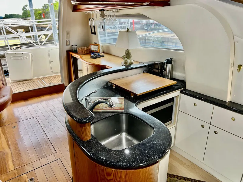 Slide: The Image of Luxurious kitchen interior of 2001 Maxum 4600 SCB yacht with modern amenities. - 20