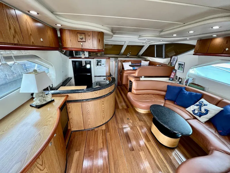 Slide: The Image of Luxurious interior of 2001 Maxum 4600 SCB yacht with wood finishes and leather seating. - 22