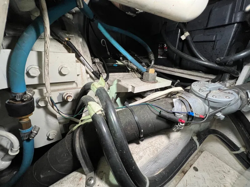 Slide: The Image of Engine compartment of a 2001 Maxum 4600 SCB boat, showing hoses and wiring. - 36