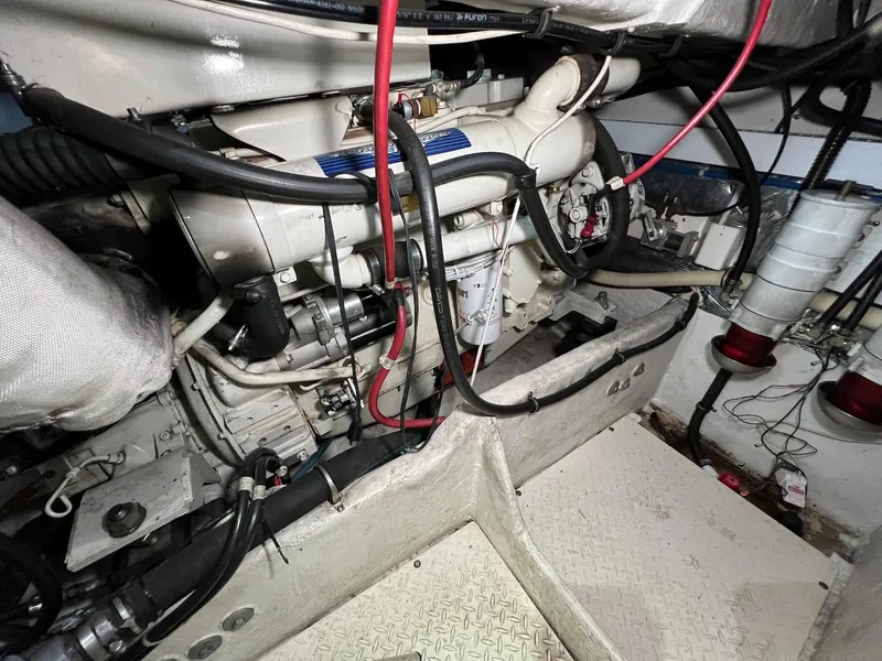 Slide: The Image of Engine room of 2001 Maxum 4600 SCB yacht, showcasing mechanical components and wiring. - 37
