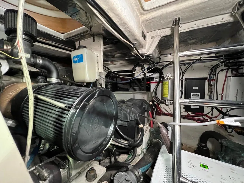 Slide: The Image of Engine room of 2001 Maxum 4600 SCB yacht, showcasing mechanical components and wiring. - 39