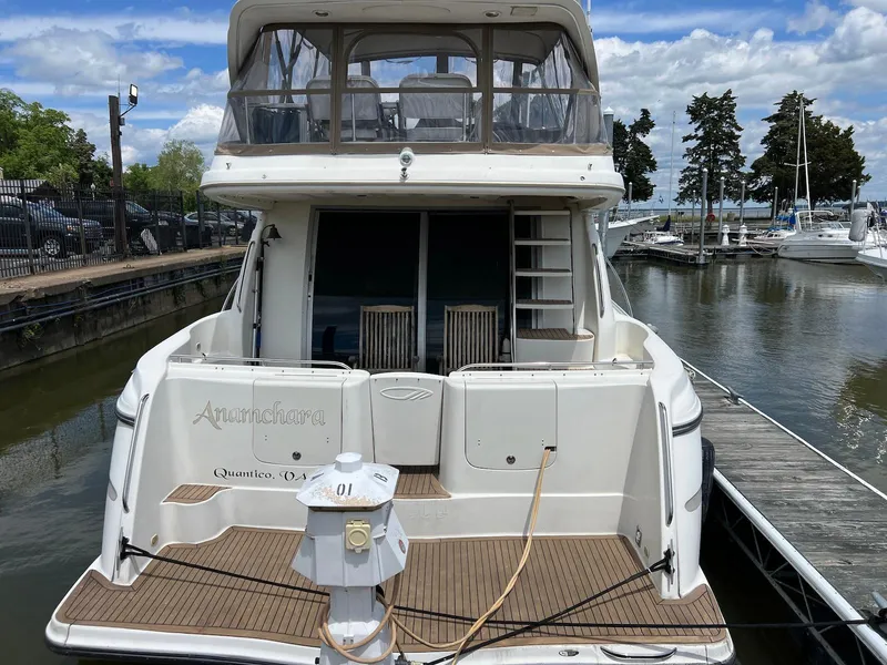 Slide: The Image of 2001 Maxum 4600 SCB yacht docked at marina, rear view. - 5