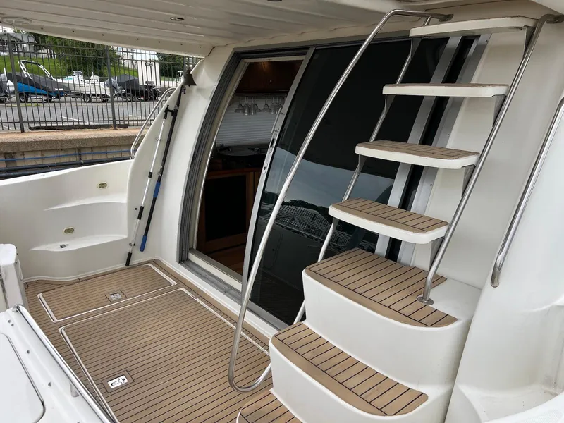 Slide: The Image of 2001 Maxum 4600 SCB yacht with teak deck and stainless steel stairs. - 9