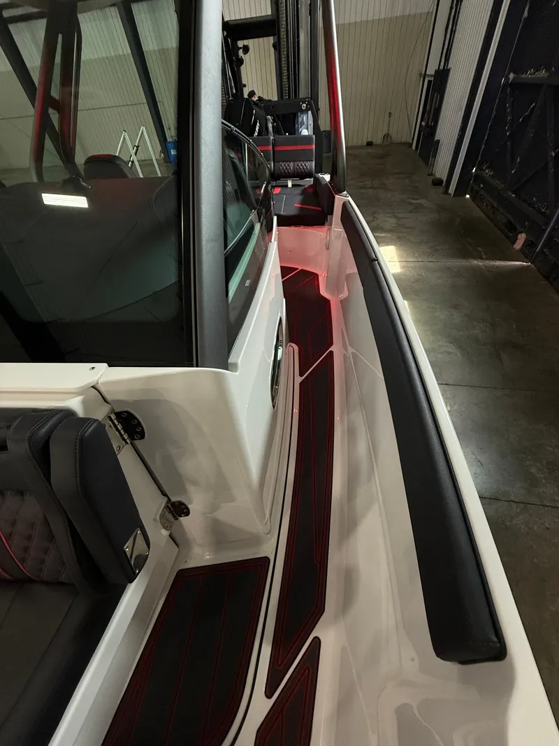 Slide: The Image of 2025 Monterey Elite 27 OB boat interior with sleek design and modern features. - 13