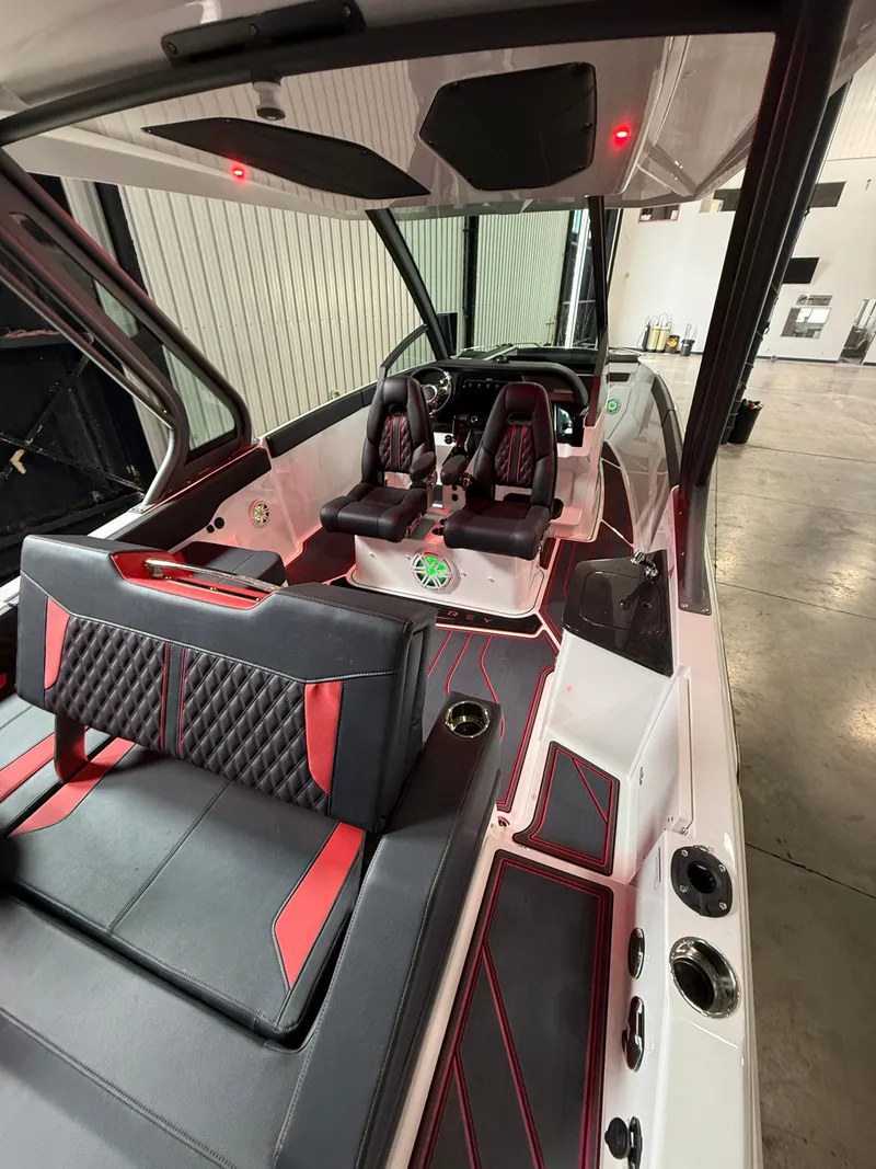 Slide: The Image of 2025 Monterey Elite 27 OB boat interior with modern seating and sleek design. - 6