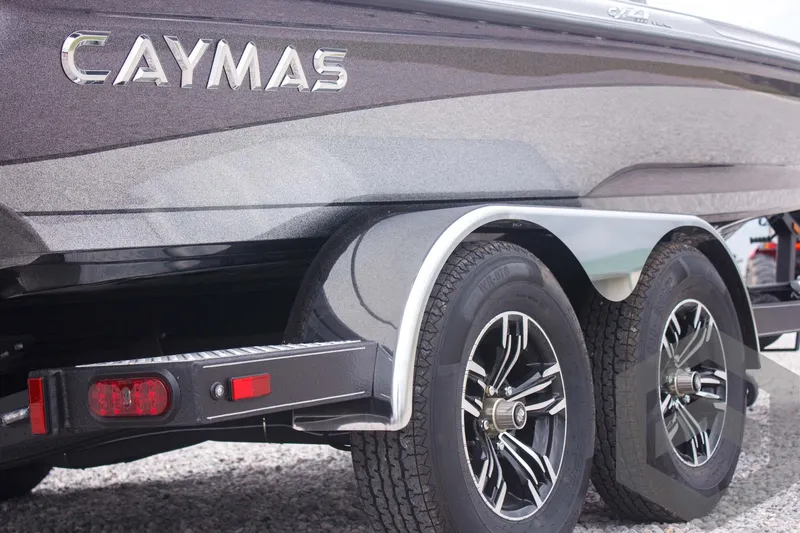 Slide: The Image of 2025 Caymas CX 21 PRO boat trailer with dual wheels and sleek design. - 12