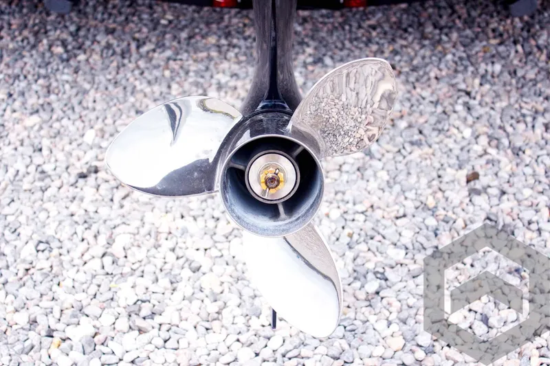 Slide: The Image of Propeller of 2025 Caymas CX 21 PRO boat on gravel surface. - 15