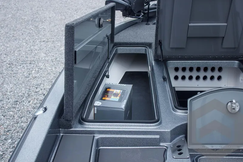 Slide: The Image of 2025 Caymas CX 21 PRO boat storage compartment with Garmin electronics box. - 24