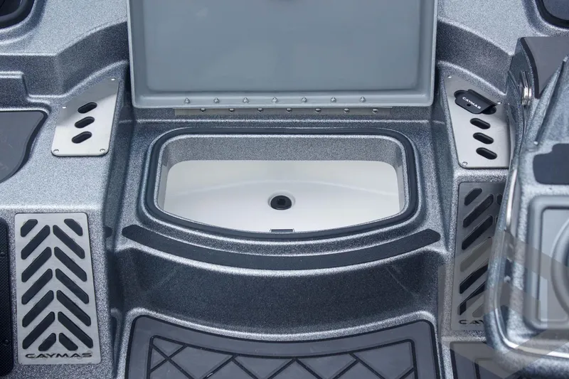 Slide: The Image of 2025 Caymas CX 21 PRO boat interior with open storage compartment and sleek design. - 26