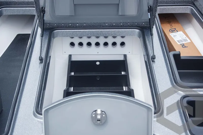 Slide: The Image of 2025 Caymas CX 21 PRO boat storage compartments with organized tackle storage system. - 27