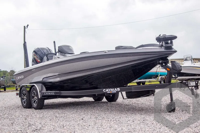 Slide: The Image of 2025 Caymas CX 21 PRO boat on trailer, sleek design, parked outdoors. - 3