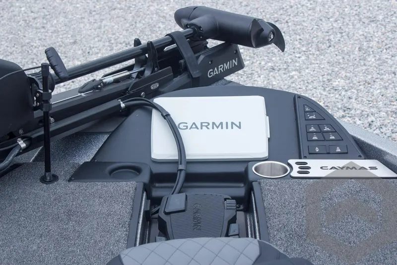 Slide: The Image of 2025 Caymas CX 21 PRO boat dashboard featuring Garmin electronics and control panel. - 30