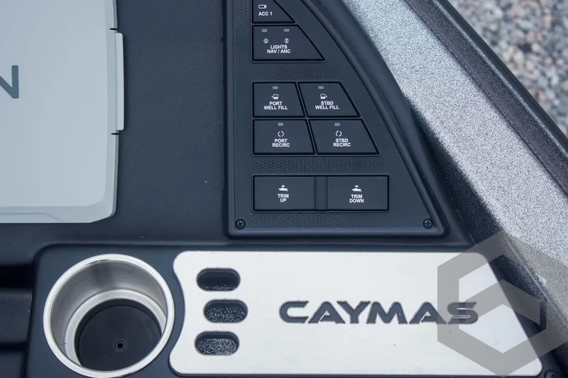 Slide: The Image of Control panel of 2025 Caymas CX 21 PRO boat with cup holder and logo. - 33