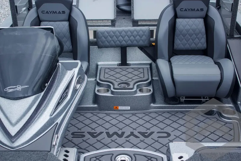 Slide: The Image of 2025 Caymas CX 21 PRO boat interior with cushioned seats and sleek design. - 35