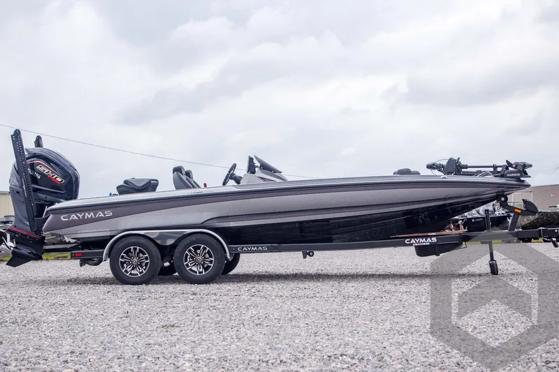 Slide: The Image of 2025 Caymas CX 21 PRO boat on a trailer, side view, outdoors. - 4
