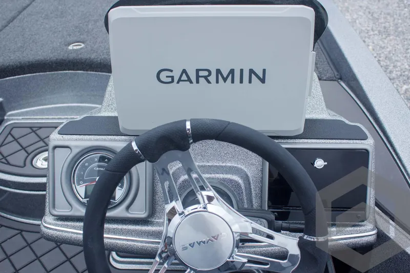 Slide: The Image of 2025 Caymas CX 21 PRO boat dashboard with Garmin display and steering wheel. - 40