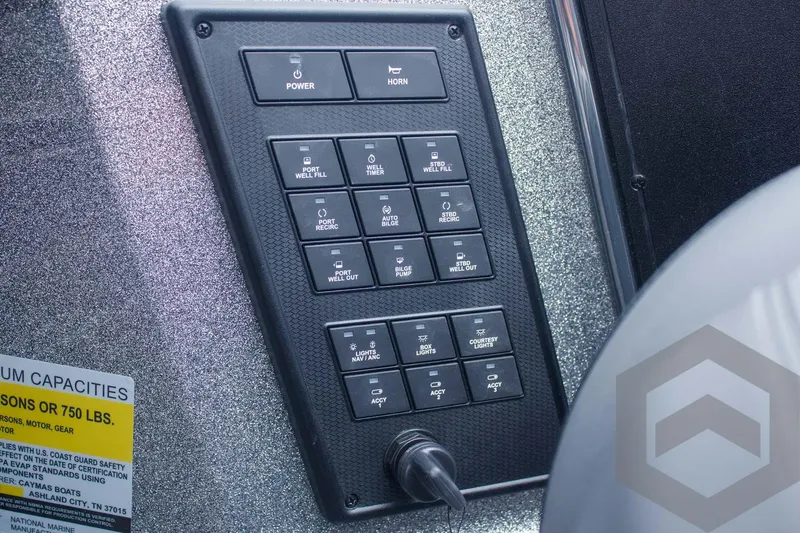 Slide: The Image of Control panel of 2025 Caymas CX 21 PRO boat with various switches and labels. - 43