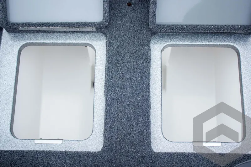 Slide: The Image of 2025 Caymas CX 21 PRO boat storage compartments, open and empty, with textured interior. - 46