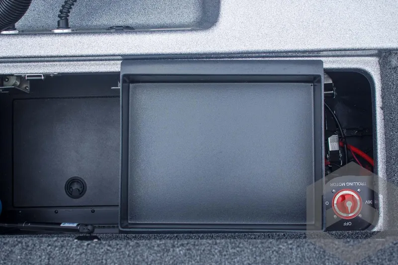 Slide: The Image of 2025 Caymas CX 21 PRO storage compartment with battery switch and wiring. - 49