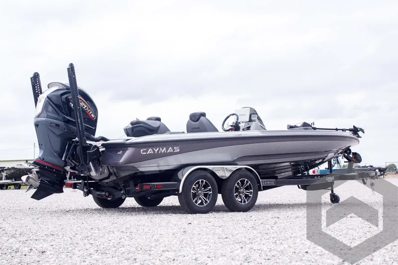 Slide: The Image of 2025 Caymas CX 21 PRO boat on trailer, side view, parked on gravel. - 5