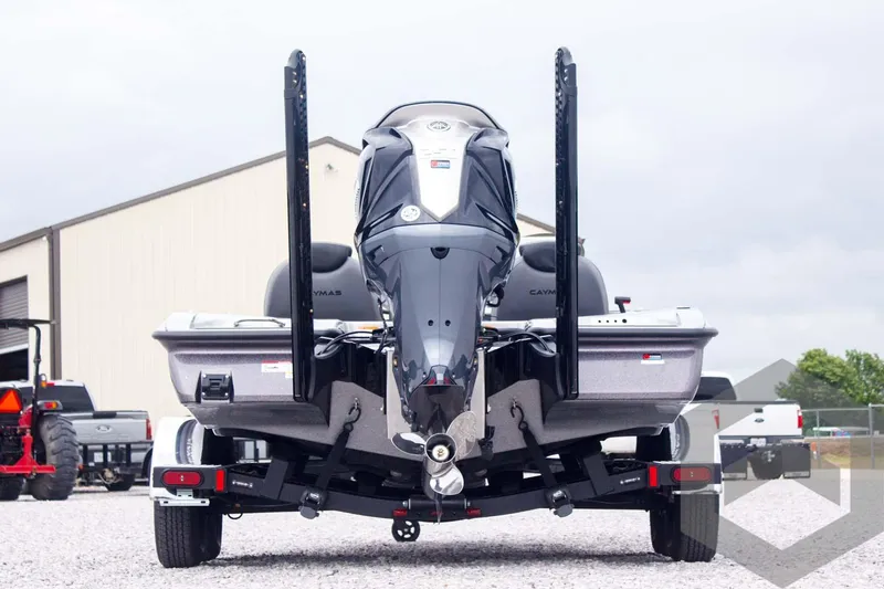Slide: The Image of 2025 Caymas CX 21 PRO boat on trailer, rear view, parked outdoors. - 6