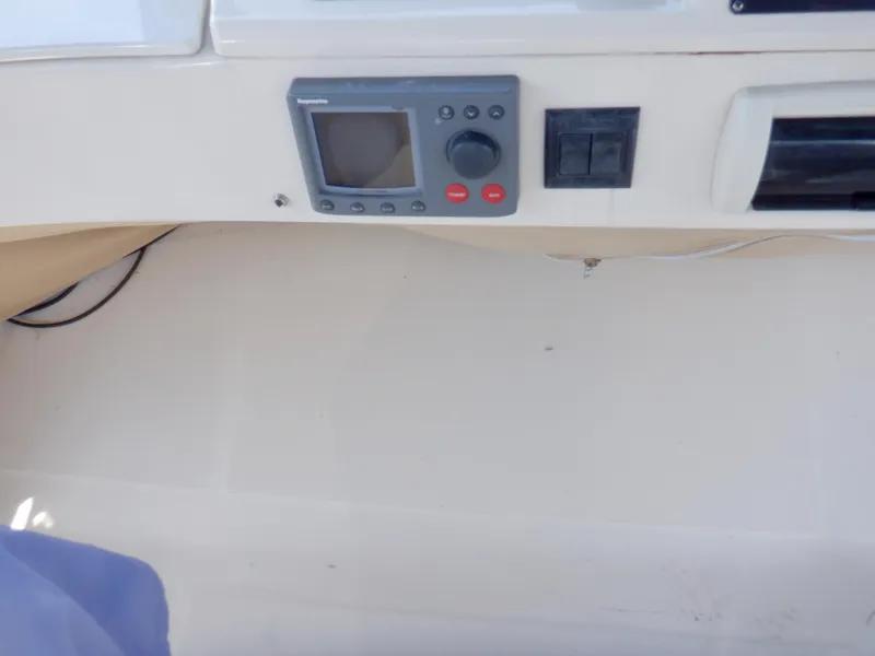 Slide: The Image of Control panel of a 2006 Mainship 34 Trawler boat. - 32