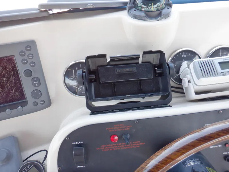 Slide: The Image of Control panel of a 2006 Mainship 34 Trawler with navigation instruments and gauges. - 33