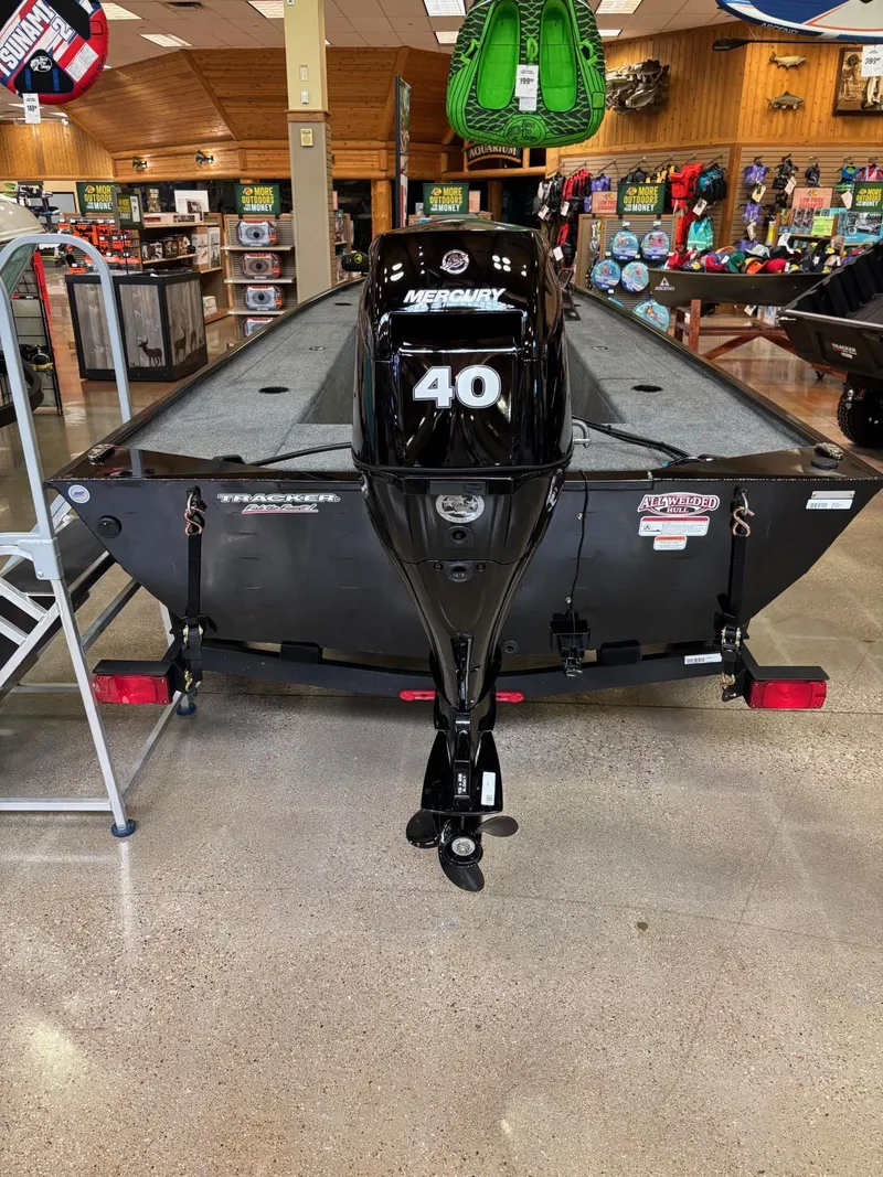 Slide: The Image of 2025 Tracker Panfish 17 boat interior with gray seating and control panel. - 3