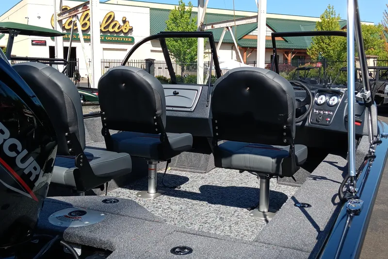 Slide: The Image of 2025 Tracker Pro Guide V-16 WT boat interior with three seats and control panel. - 3