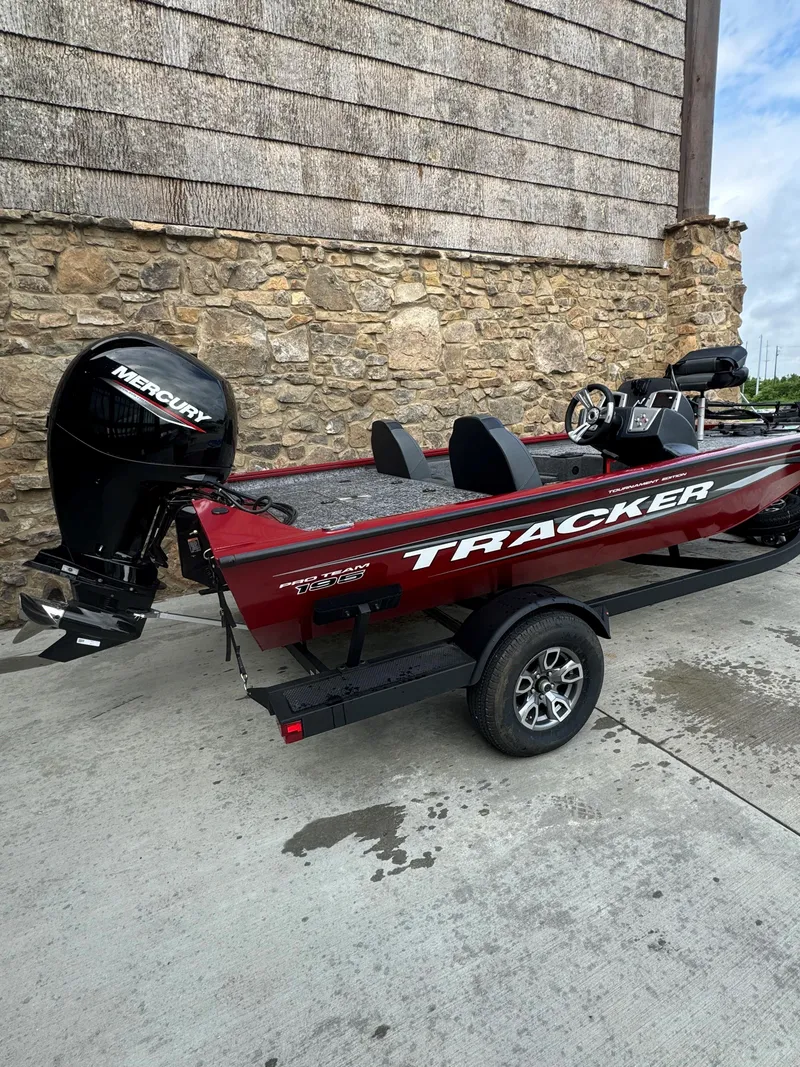 Slide: The Image of Steering wheel of 2025 Tracker Pro Team 195 Tournament Edition boat, featuring modern dashboard controls. - 2