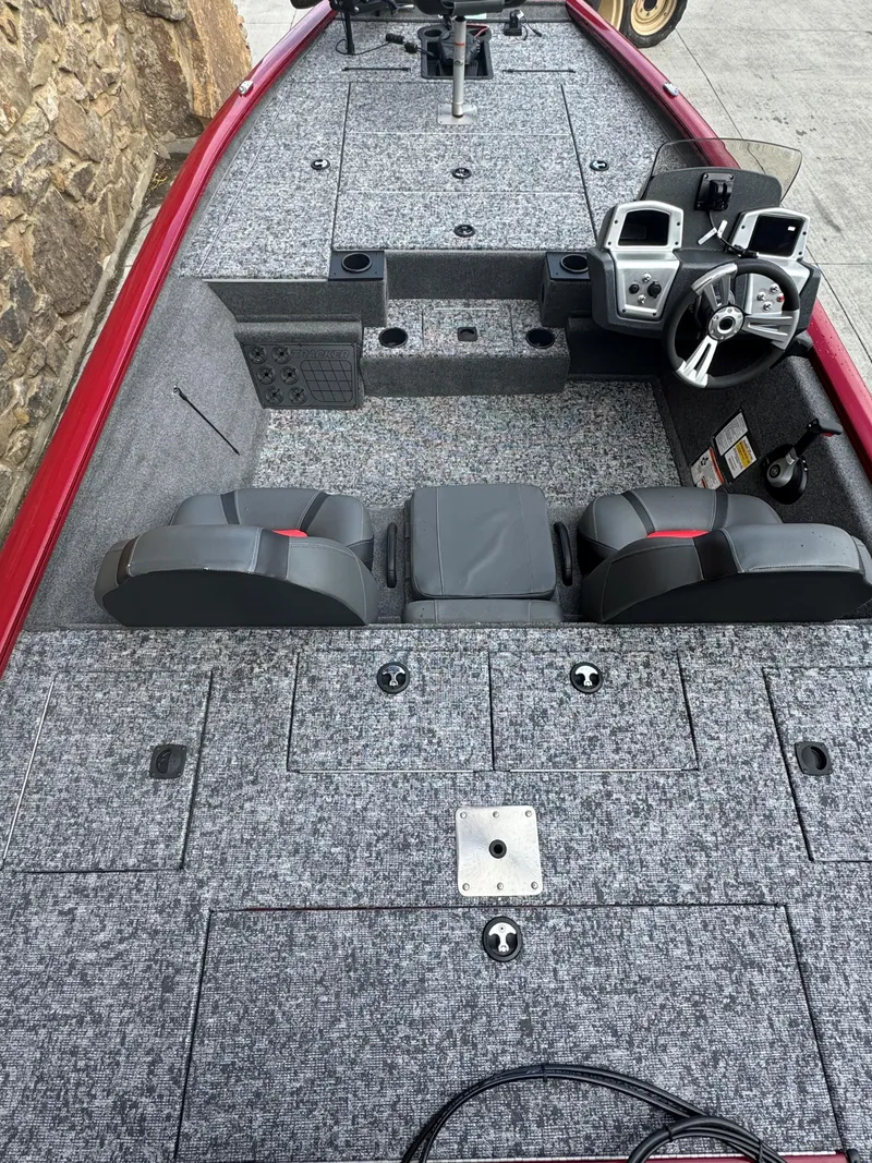 Slide: The Image of 2025 Tracker Pro Team 195 Tournament Edition boat deck with seating and storage compartments. - 3
