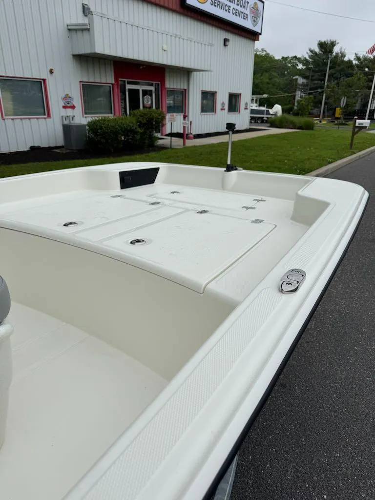 Slide: The Image of 2025 Mako Pro Skiff 15 CC boat near service center, exterior view. - 9