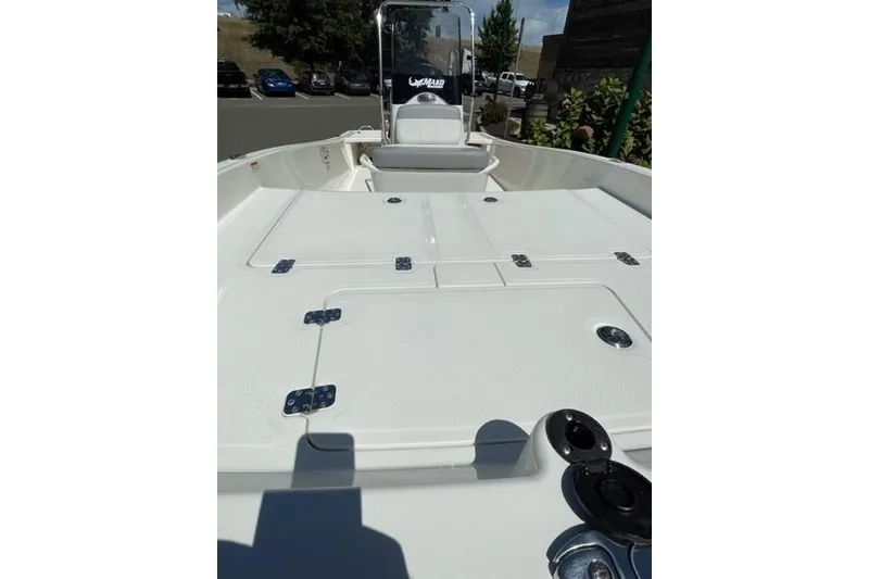 Slide: The Image of 2025 Mako Pro Skiff 15 CC boat deck with storage compartments. - 3
