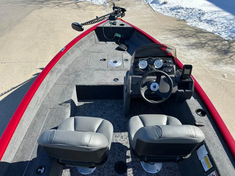 Slide: The Image of 2025 Tracker Super Guide V-16 SC boat interior with dual seats and steering console. - 4