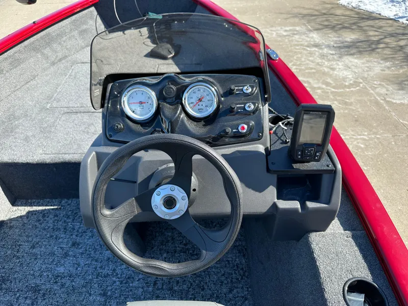 Slide: The Image of 2025 Tracker Super Guide V-16 SC boat dashboard with steering wheel and gauges. - 5