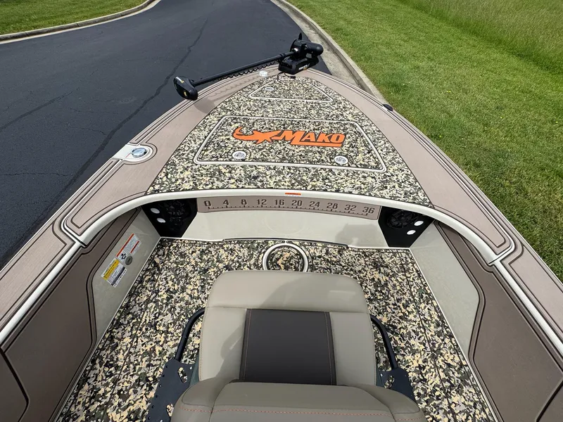 Slide: The Image of 2025 Mako 18 Pro Skiff Backwater Edition with camo deck and seating. - 5