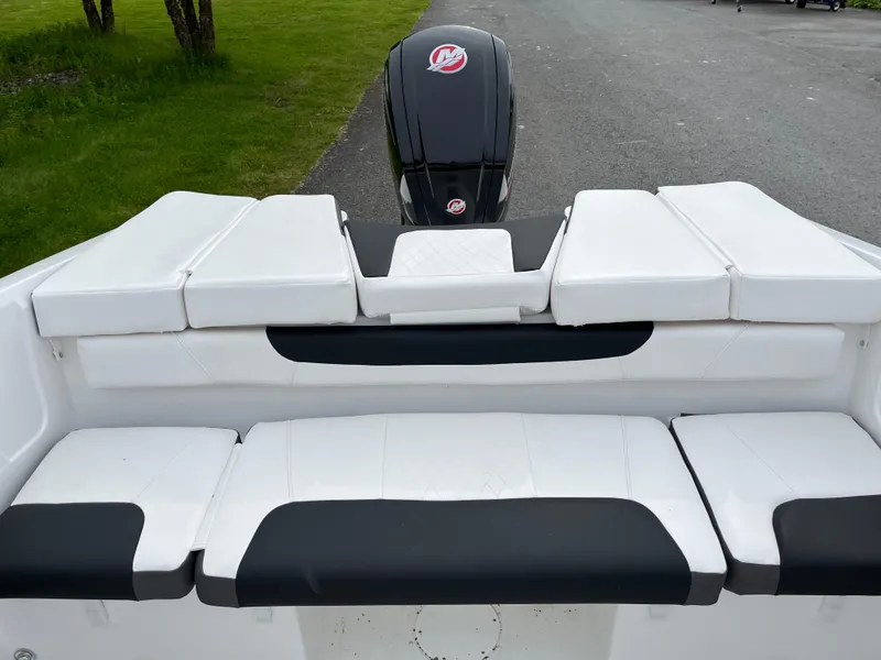 Slide: The Image of 2025 Tahoe 185 S boat interior with white and black seating, outboard motor visible. - 4